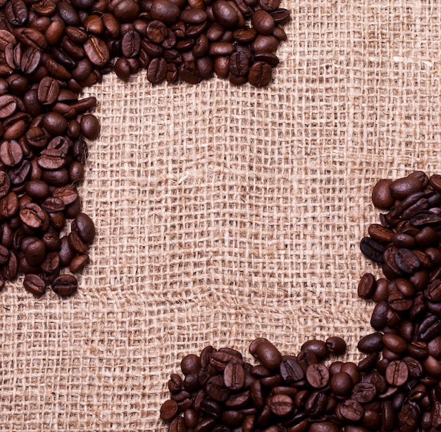 Coffee beans over cloth sack