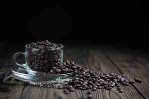 Free photo coffee beans in cup on table