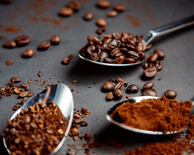 Coffee beans on iron spoon