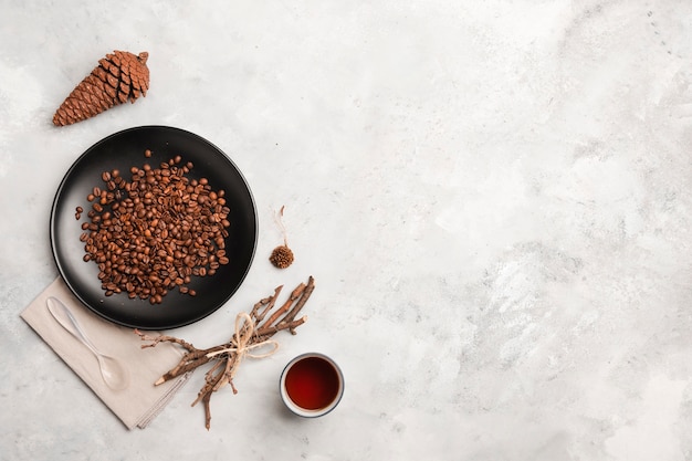 Coffee beans on plate copy space