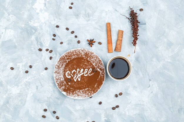 Coffee beans and spices on grunge background