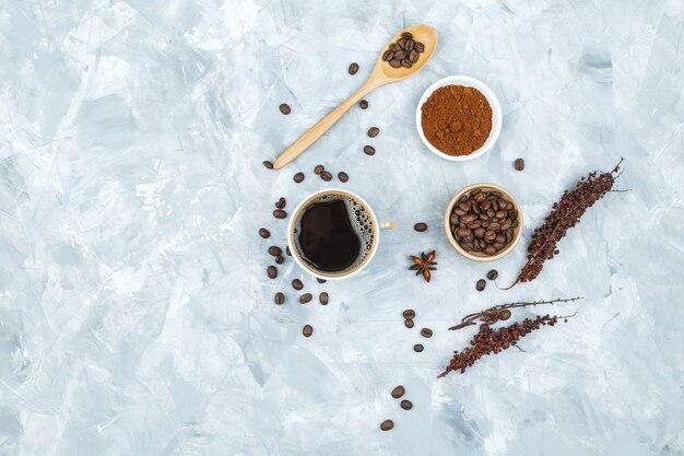 Coffee beans and spices on grunge background