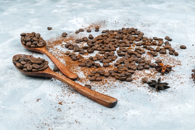 Coffee beans and spices on grunge background