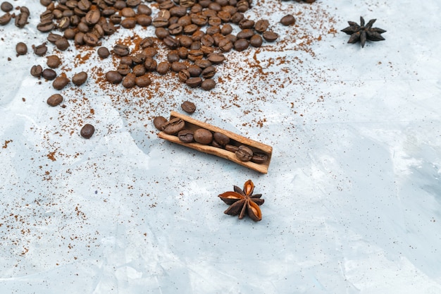 Coffee beans and spices on grunge background