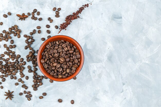 Coffee beans and spices on grunge background