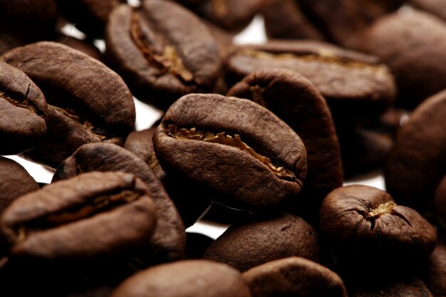 Coffee beans over white background