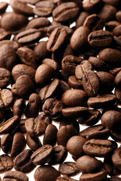 Coffee beans over white background