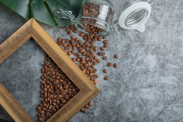 Free photo coffee beans with frame on a gray background .