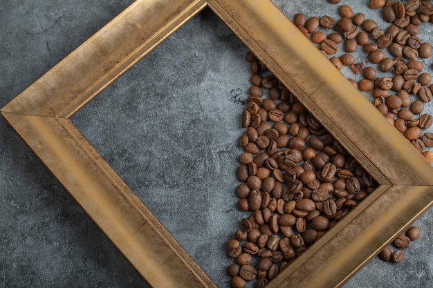 Coffee beans with frame on a gray background . 