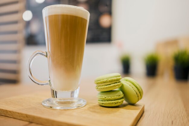 Free photo coffee beverage and macarons