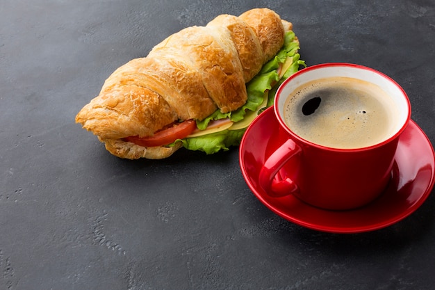 Free photo coffee beverage and sandwich