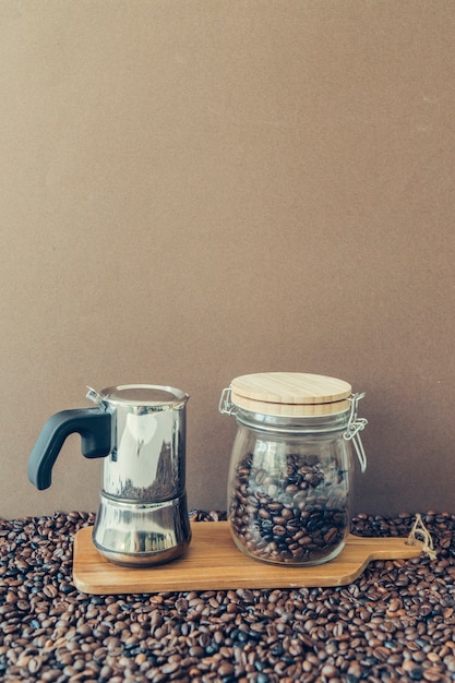 Coffee composition with moka pot and jar on board