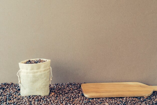Coffee concept with bag and wooden board