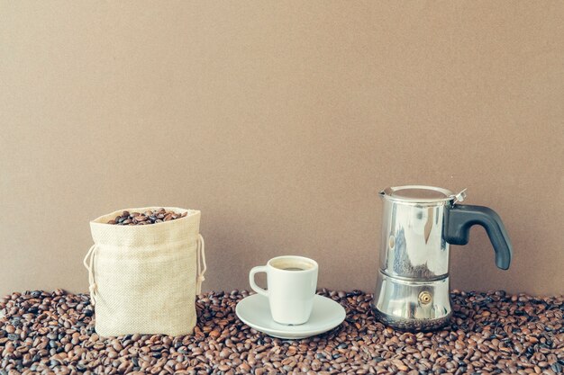 Coffee concept with cotton bag and moka pot