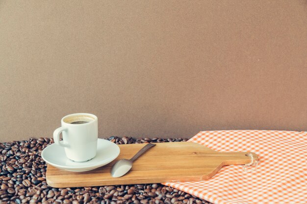 Coffee concept with espresso on wooden board