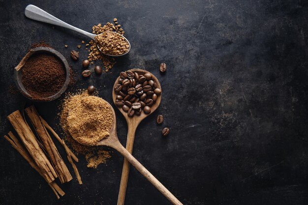 Coffee concept with ground and instant coffee coffee beans sugar on dark vintage background Top View