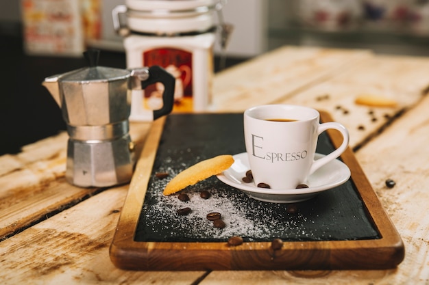 Coffee and cookie on table