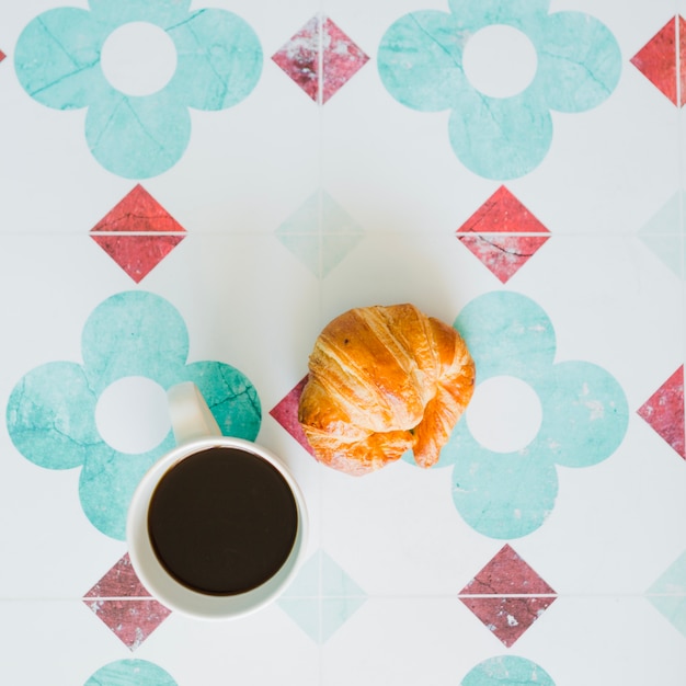 Coffee cup and baked bun