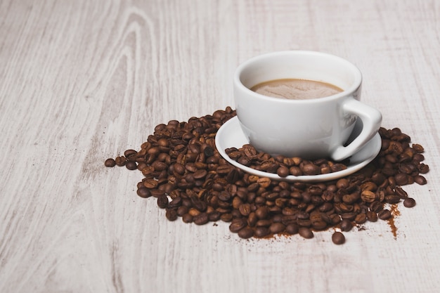 Coffee cup on beans