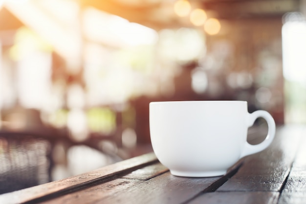 Free photo coffee cup in coffee shop, vintage style.