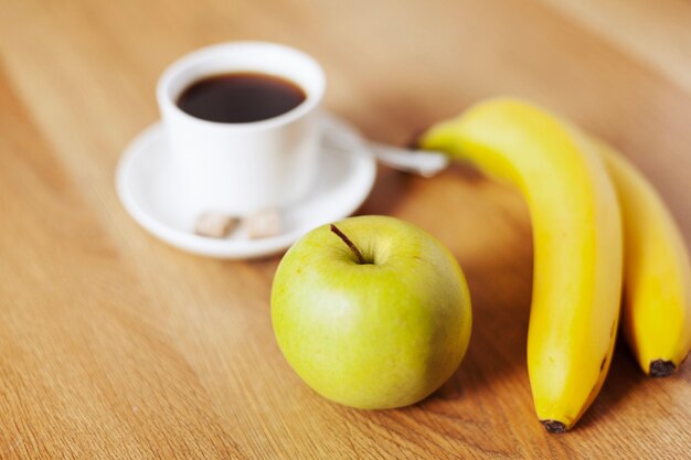 Coffee cup and fruits