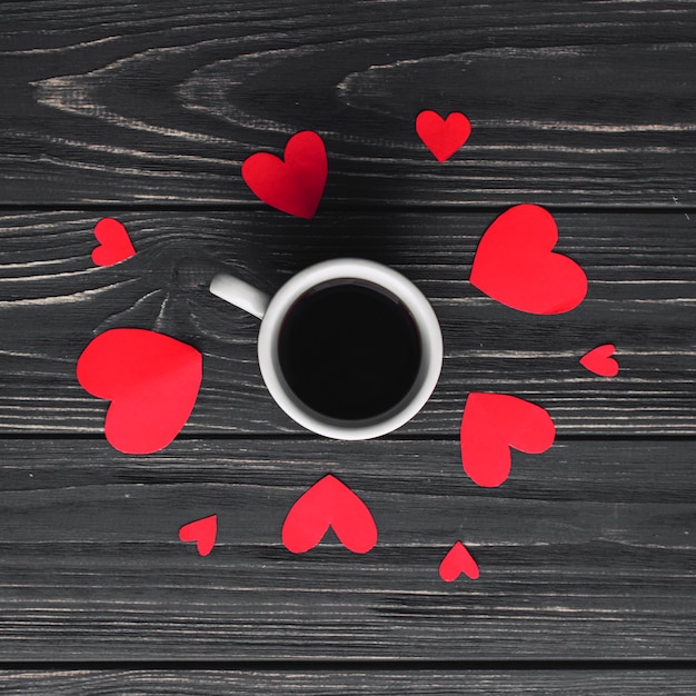 Coffee cup and paper hearts