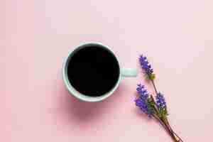 Free photo coffee cup on pink background