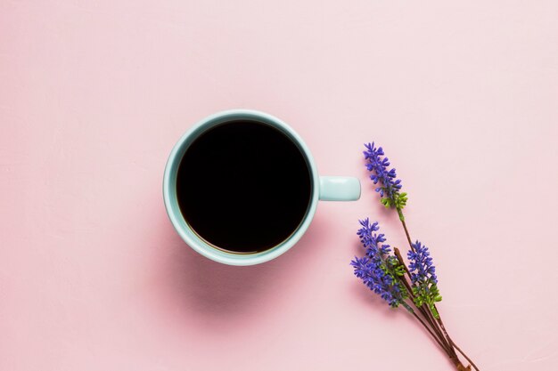 Coffee cup on pink background