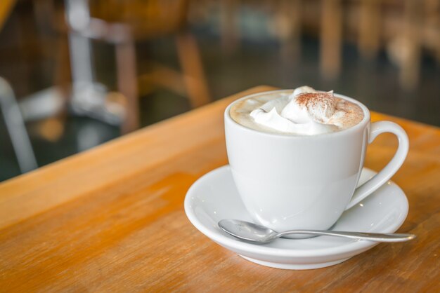 Coffee cup on table in cafe