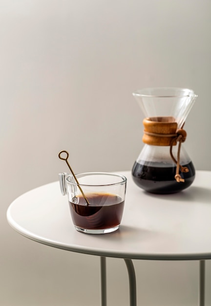 Coffee cup on table with chemex and copy space