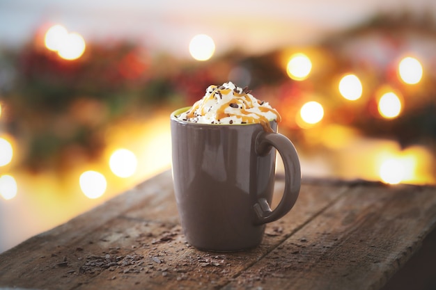 Coffee cup with caramel and whipped cream