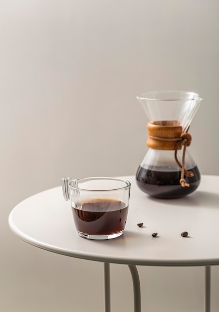 Coffee cup with chemex on table