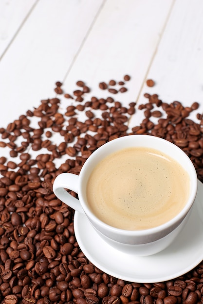 Coffee cup with coffee beans