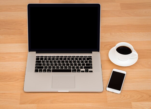 Coffee cup with laptop and smartphone