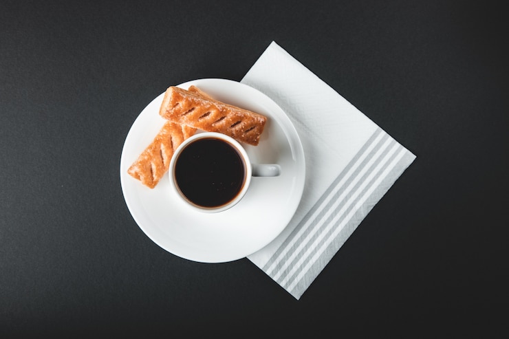 Free Photo coffee cup with sweets