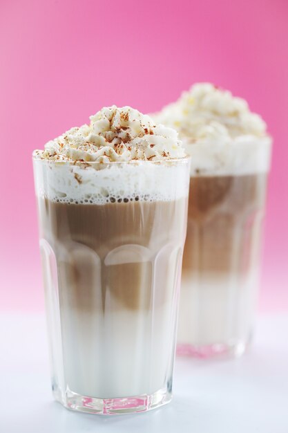 Coffee cups with caramel and whipped cream