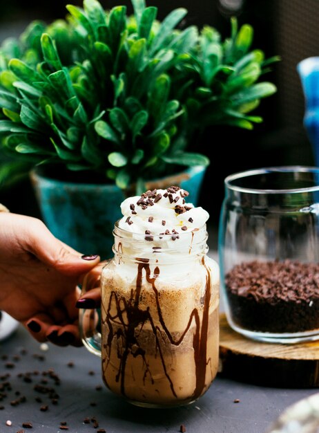 Coffee drink with whipped cream and coffee beans