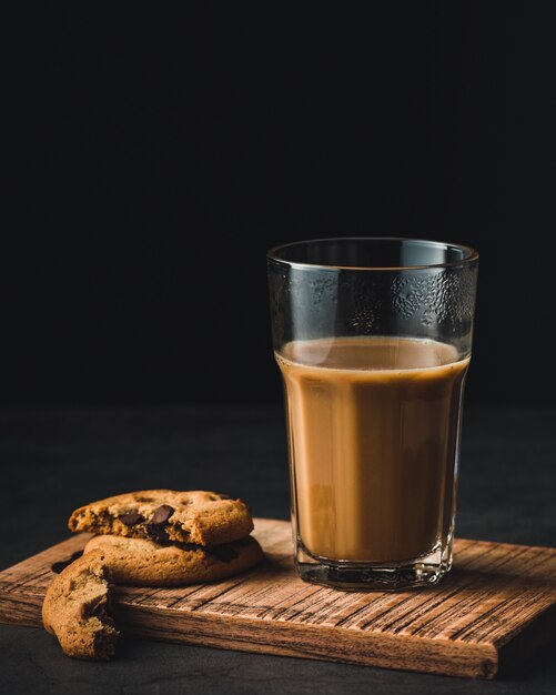 Coffee glass cup and cookies with chocolate