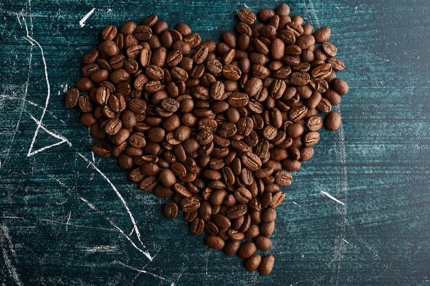 Coffee grains in heart shape. 