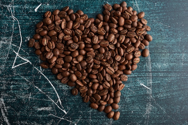 Coffee grains in heart shape. 