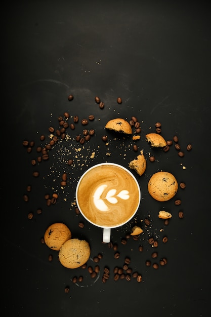 Coffee latte with cookies and coffiee beans