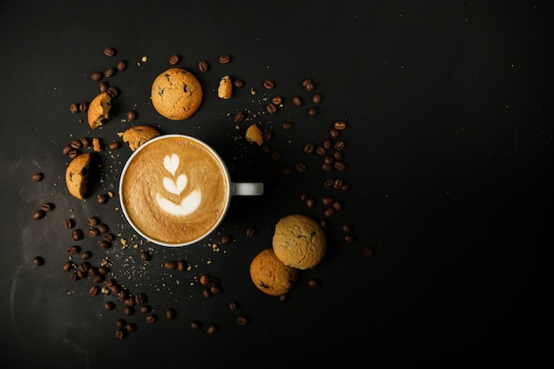 Coffee latte with cookies and coffiee beans