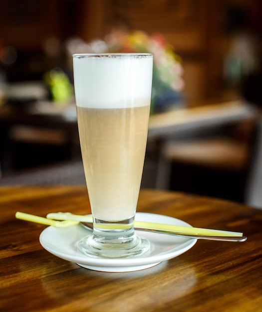 Free photo coffee latte on a wooden table