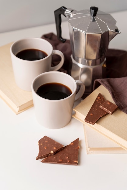 Free photo coffee machine with pieces of chocolate