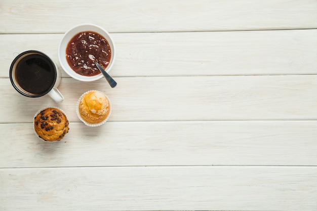 Coffee and muffins with jam
