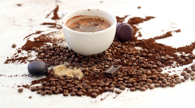 Coffee mug with coffee beans