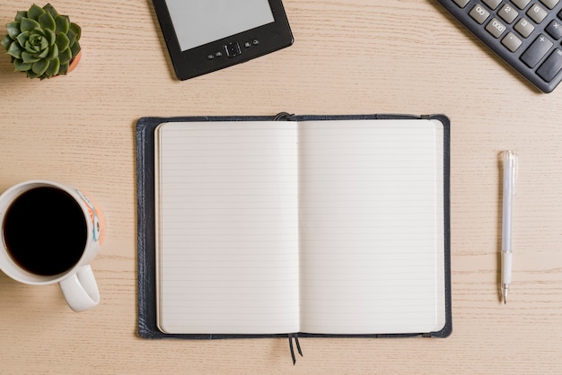 Coffee and notebook on table