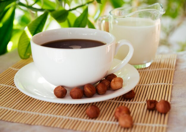 Coffee and nuts on bamboo mat