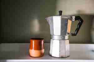 Free photo coffee pot and cup