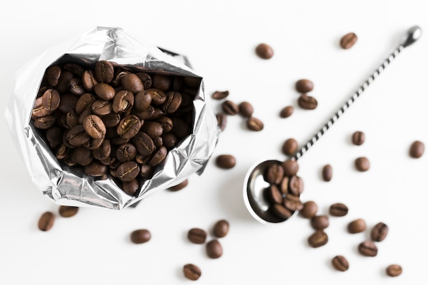 Coffee roasted beans in plastic bag top view